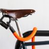tex-lock eyelet orange mit U-Lock an Ledersattel