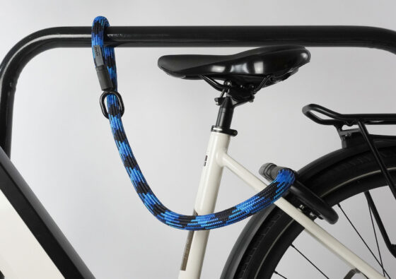 tex-lock mate in morpho blue extends frame lock by securing bike to bike stand